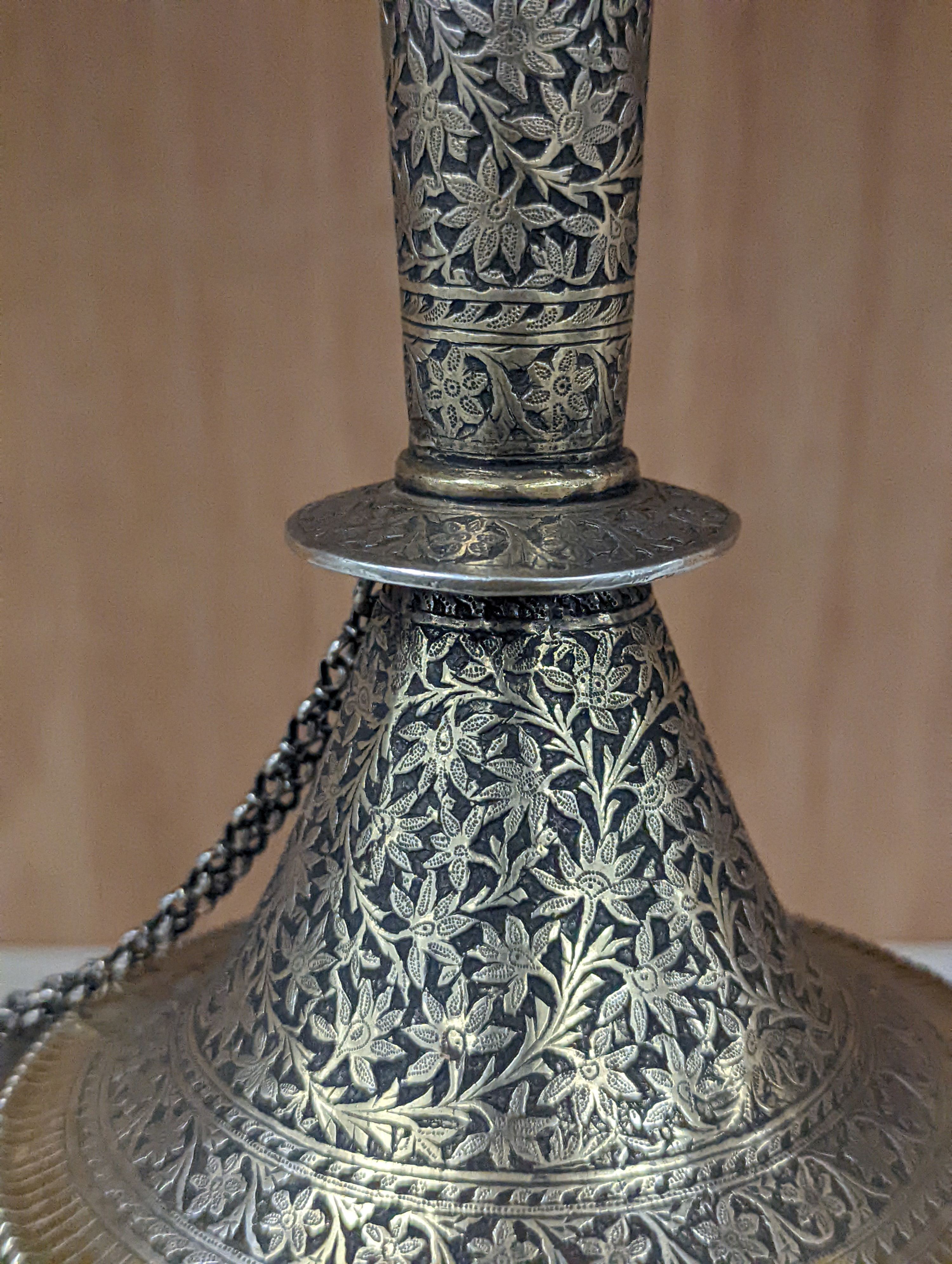 A 19th century North Indian silver surahi with engraved shawl decoration 30cm